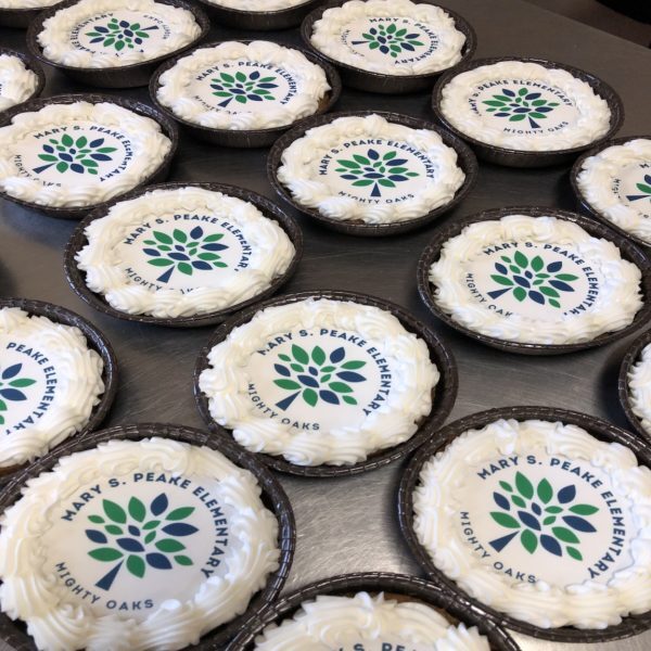 Many round cookies with vibrant logo